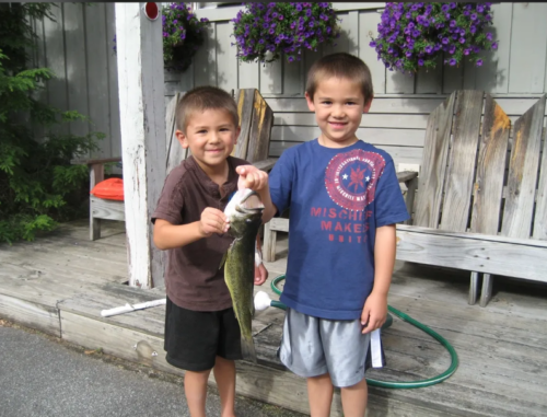 kids holding a fish